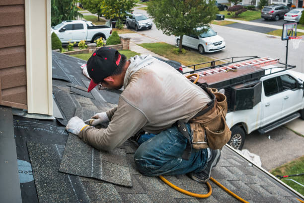 Professional Roofing technician working in Elwood, KS